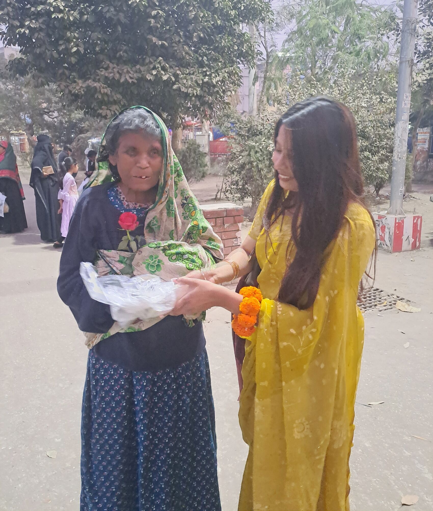 Food and Roses Distributed Among the Helpless in Gaibandha on Pahela Falgun and Valentine’s Day - Image 1